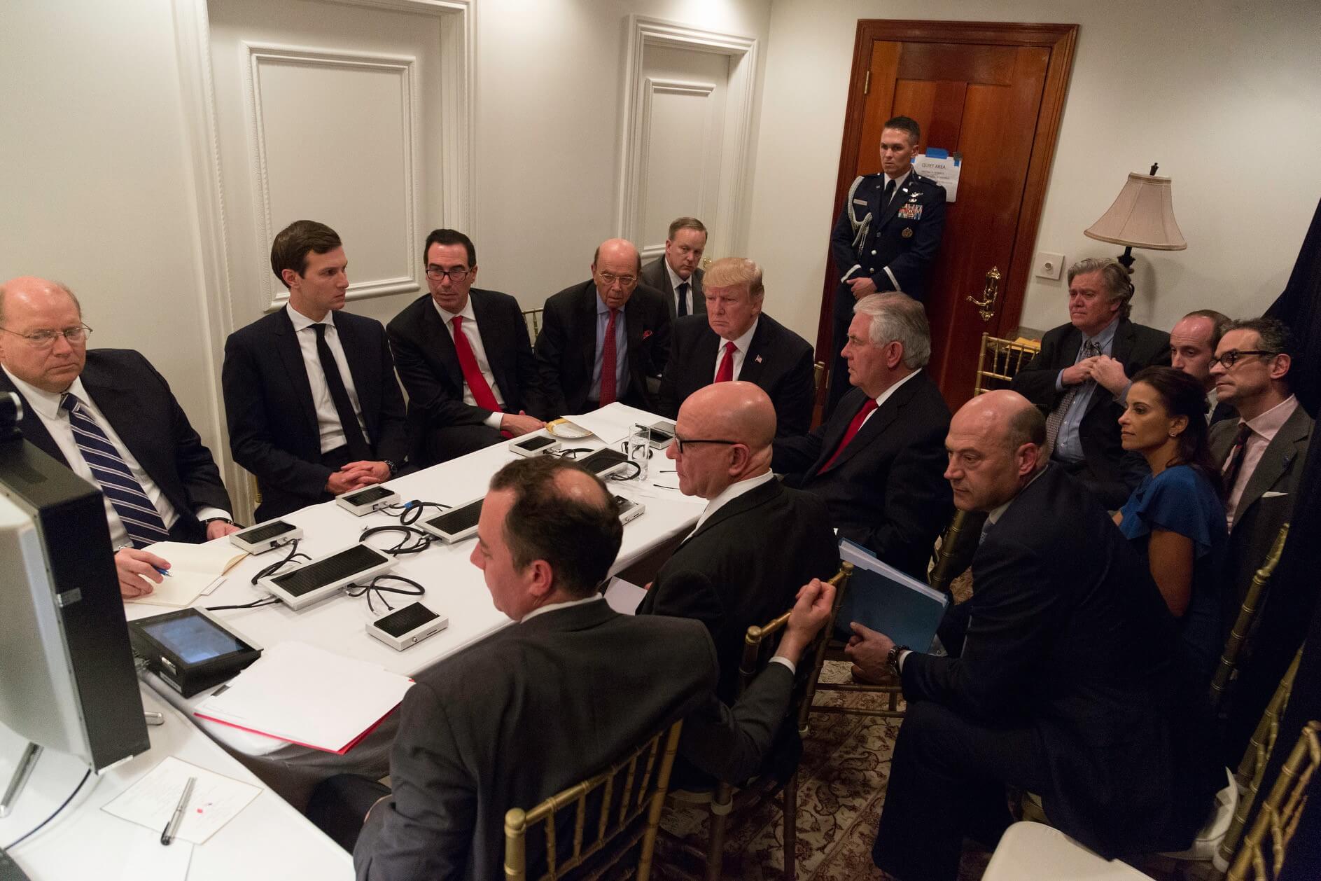 President Donald Trump receives a briefing on a military strike on Syria from his National Security team